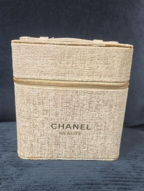 CHANEL beige textured makeup case with gold logo